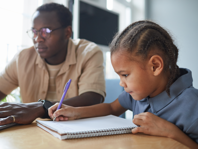 Tutor and child doing homework